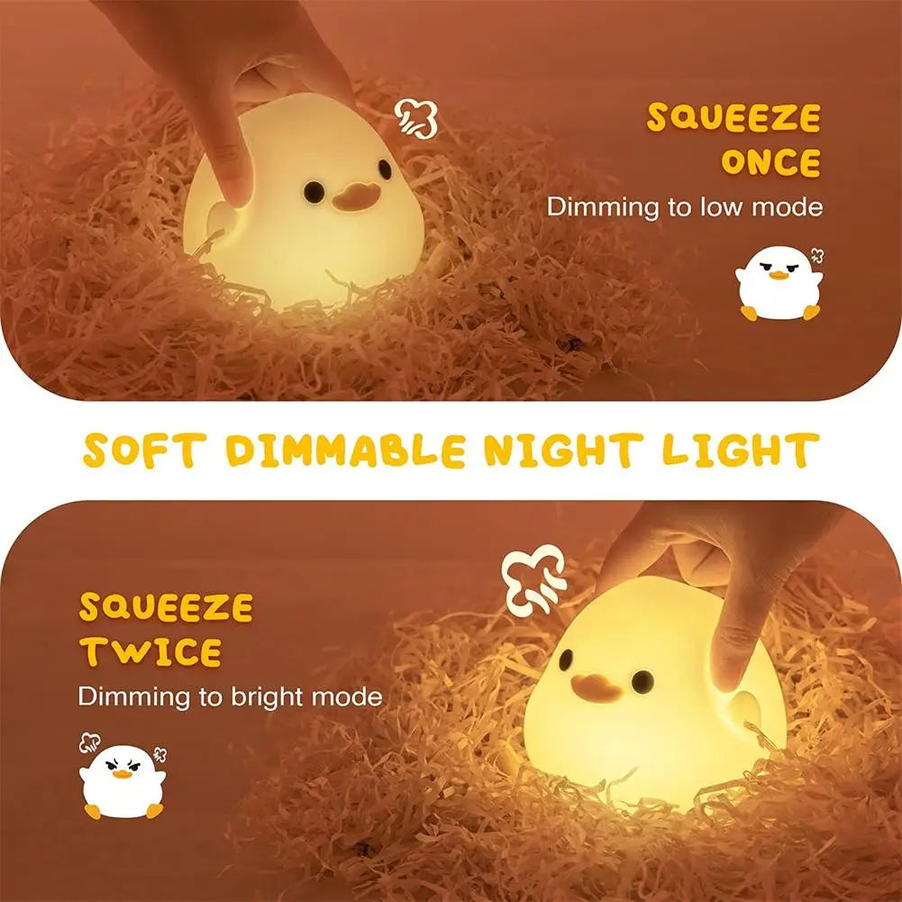 Hand squeezing the night light to show the adjustable brightness mode of the duck night light.